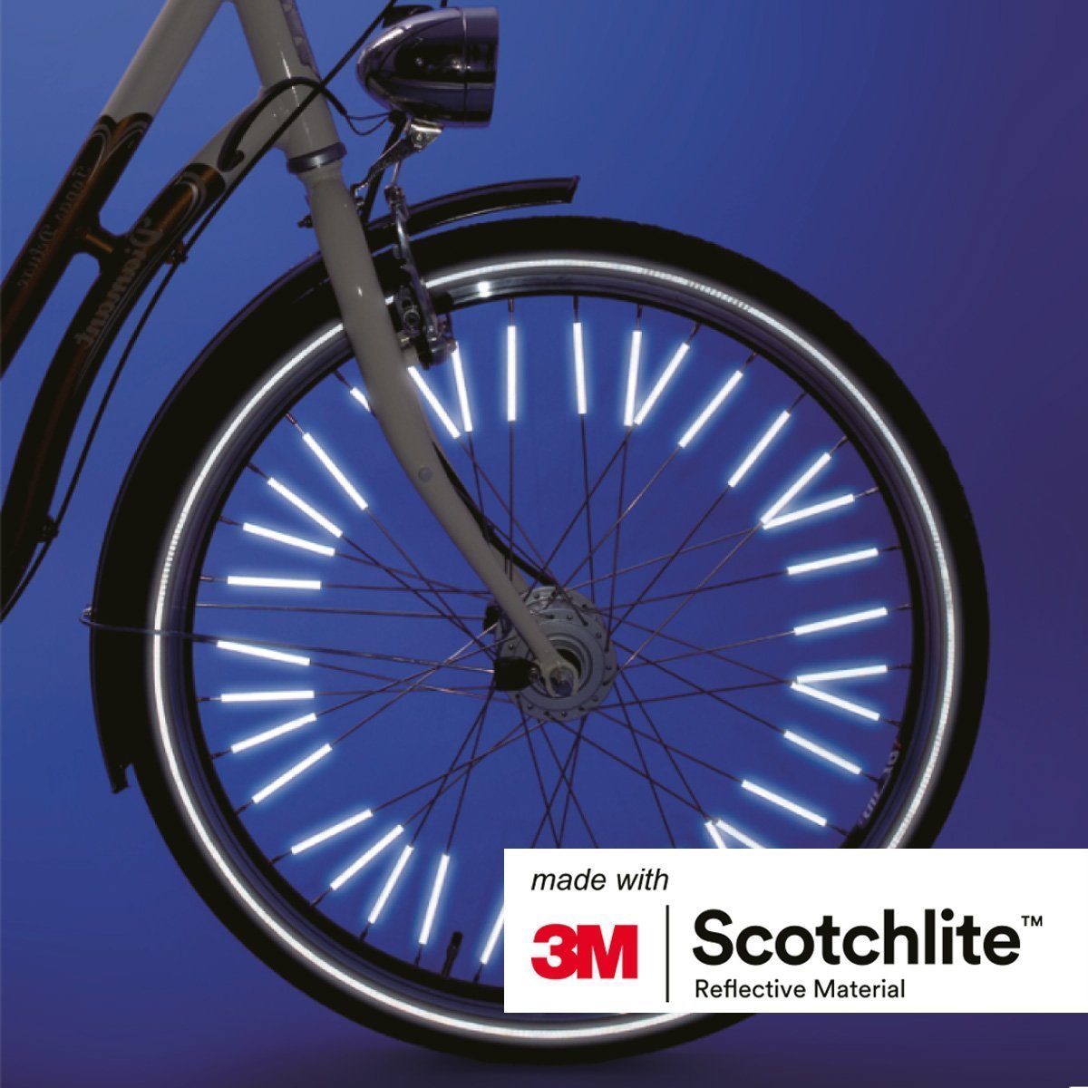 Close up of bicycle wheel with spoke reflectors on.