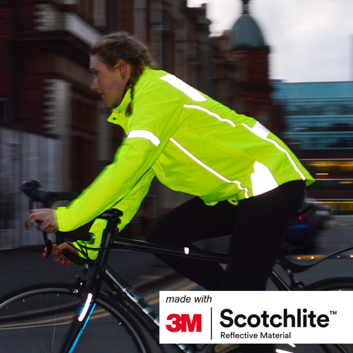Woman cycling wearing a Yellow reflective jacket