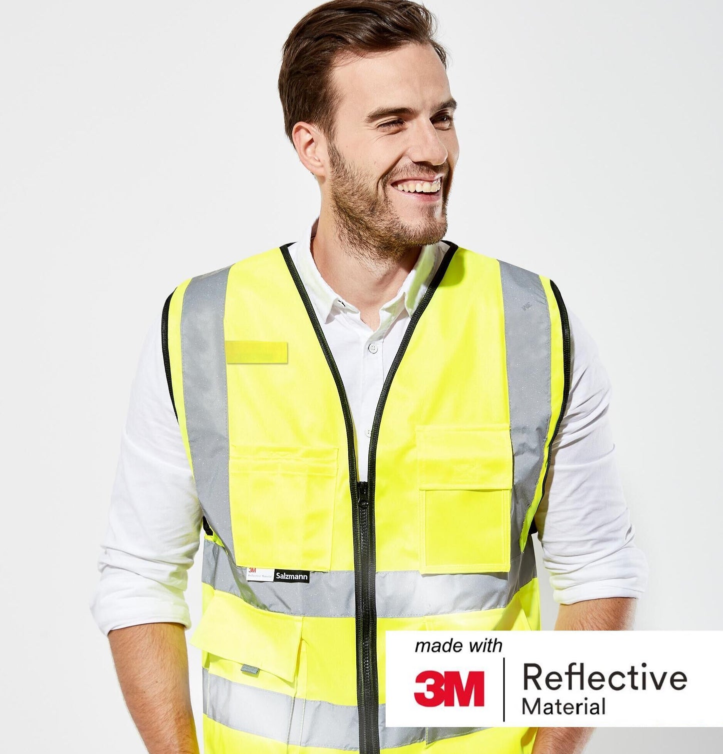 Close-up of man stood smiling wearing Yellow safety vest