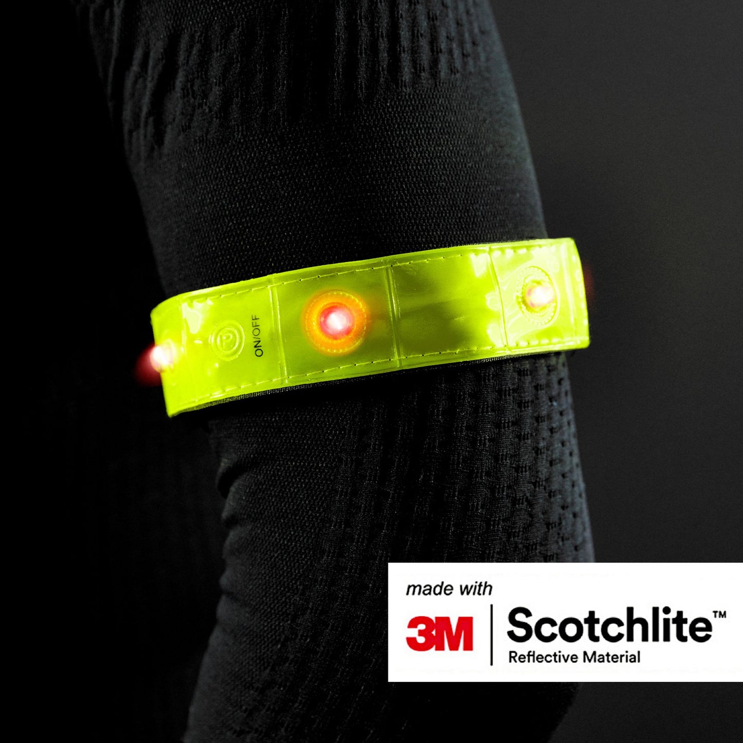 Close-up of persons arm wearing the reflective band with lights turned on.